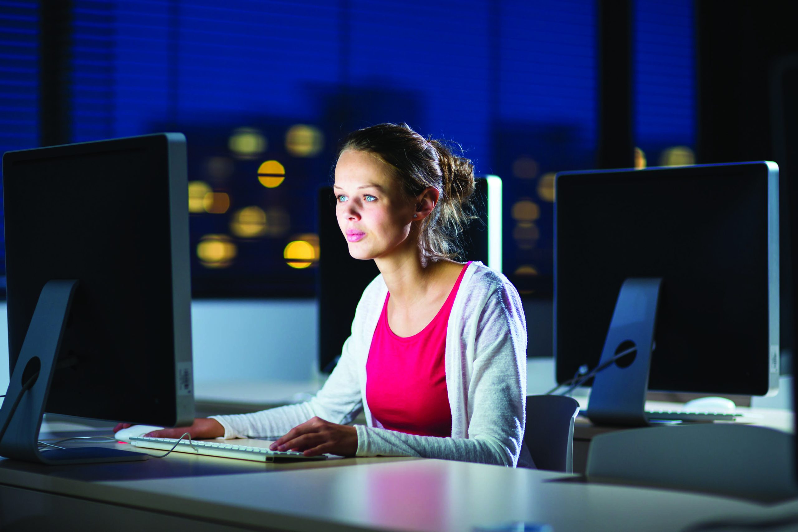A girl is working on a PC