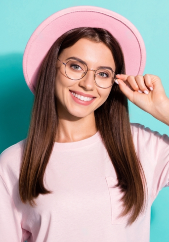 Girl with a smiling face wearing glasses