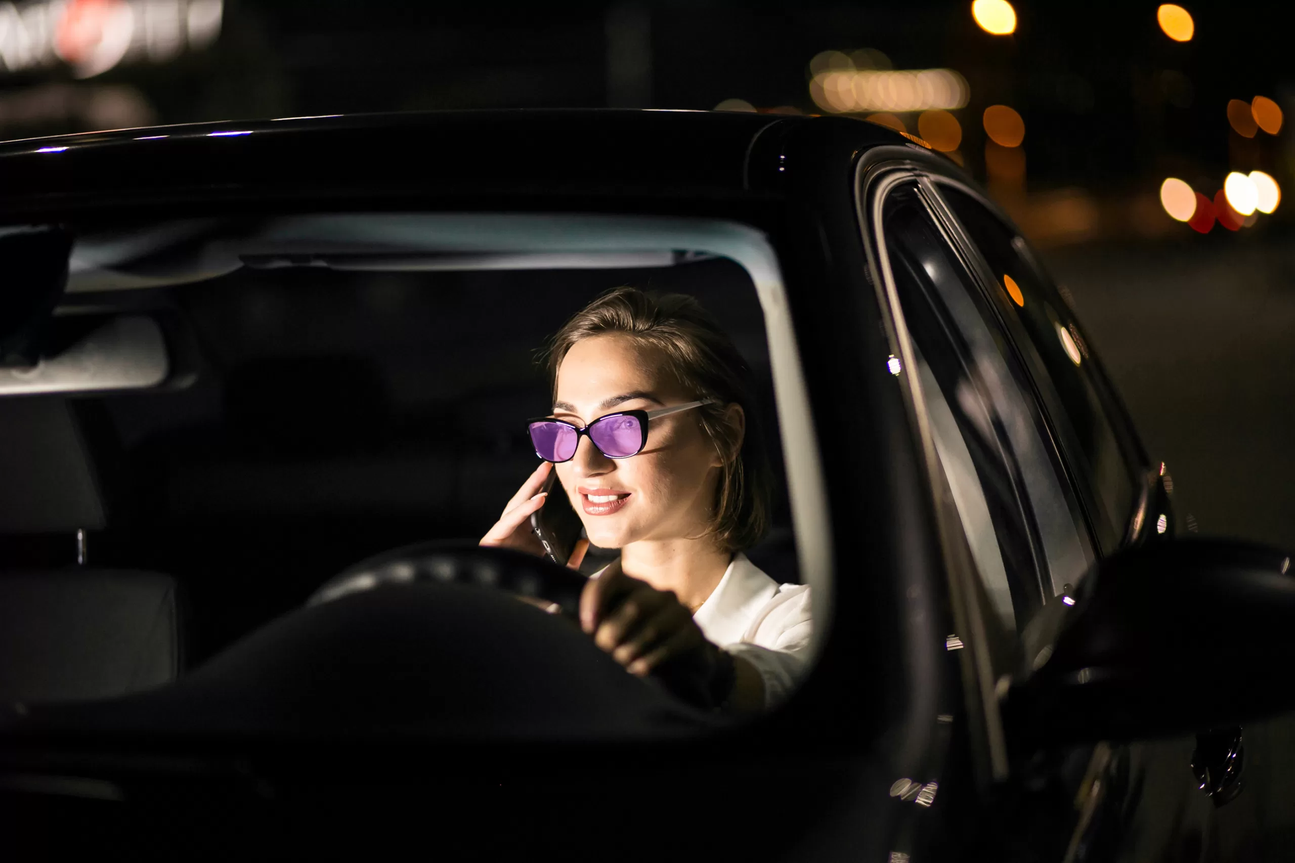 A girl wearing violet glasses